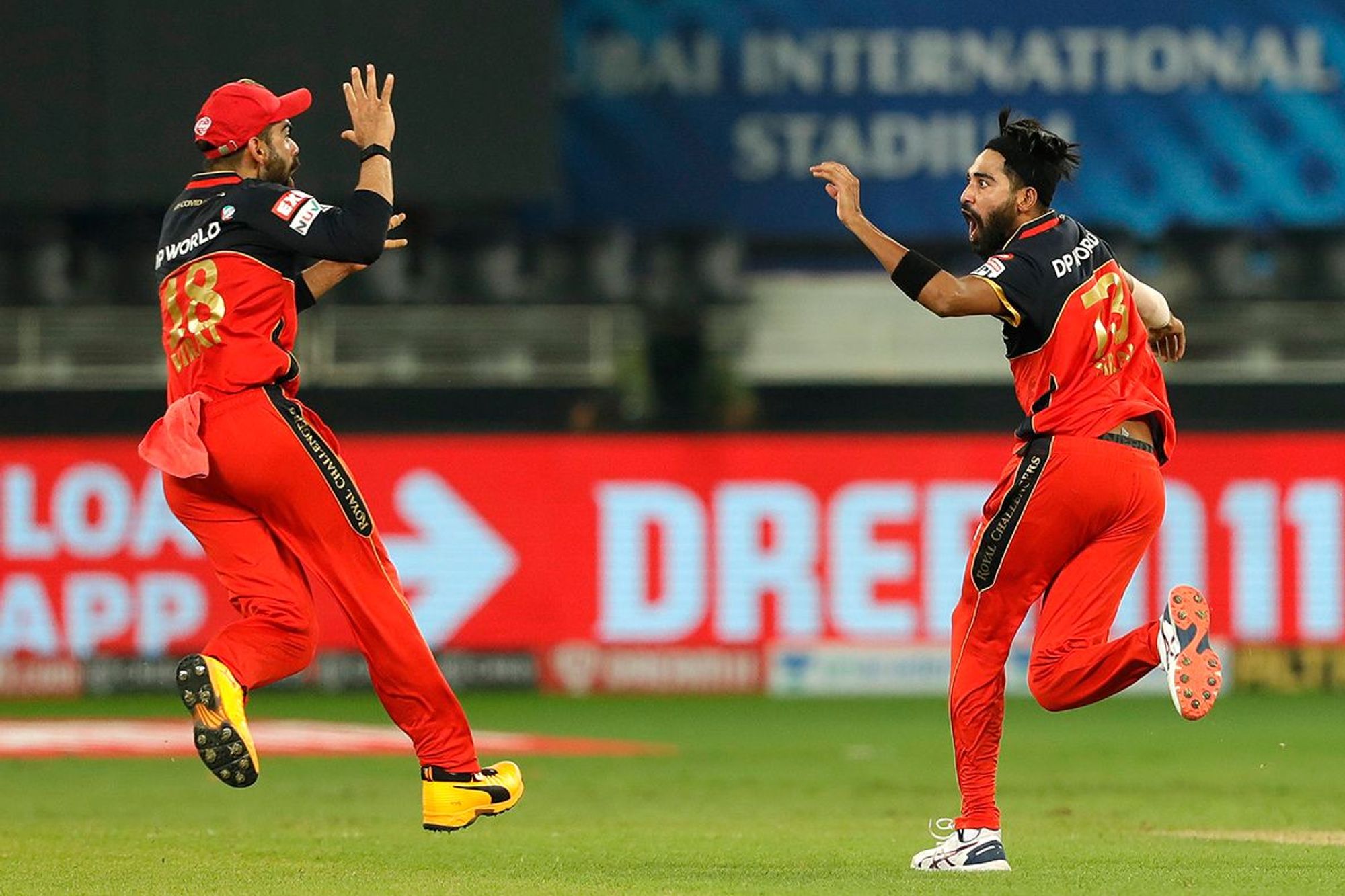 Siraj celebrating a wicket with Kohli
