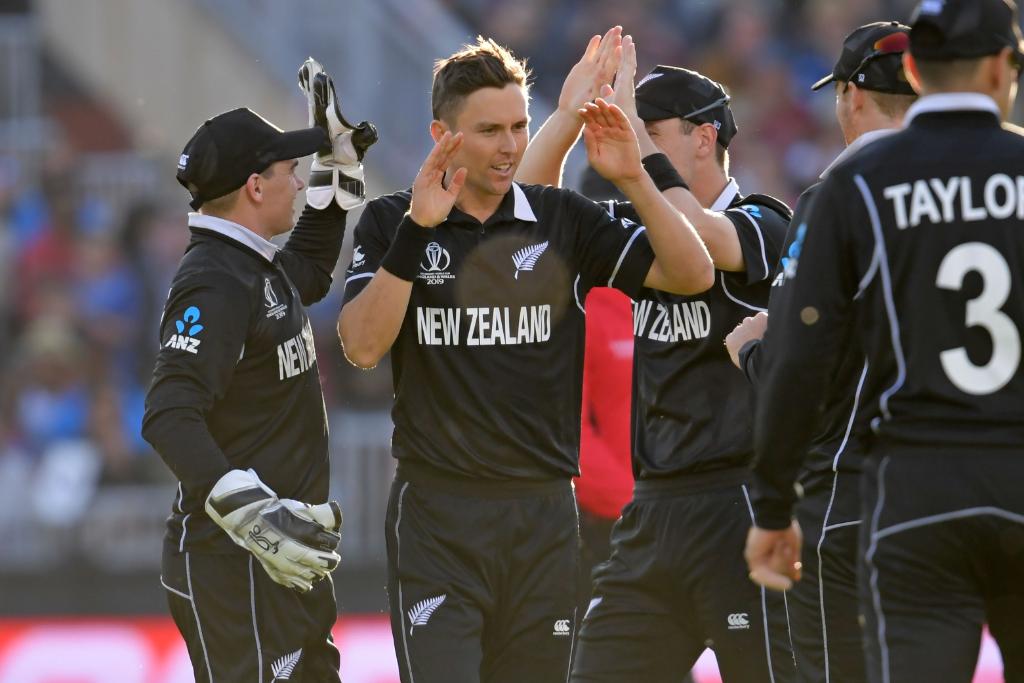 Trent Boult celebrating a wicket with his teammates